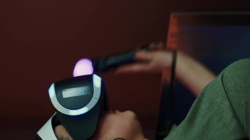 Young Adult Using Virtual Reality Headset Indoors