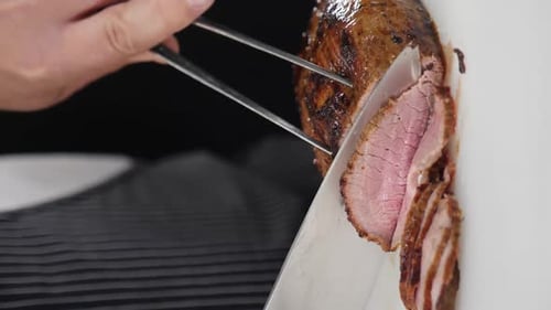 Chef Slicing a Delicious Roast Beef
