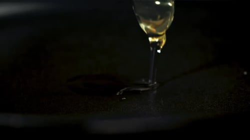 A Raw Egg Falls Onto a Frying Pan Filmed on a Highspeed Camera at 1000 Fps