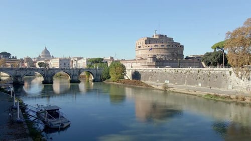 Slo rise above Tiber River and Ponte Sant'Angelo in Rome