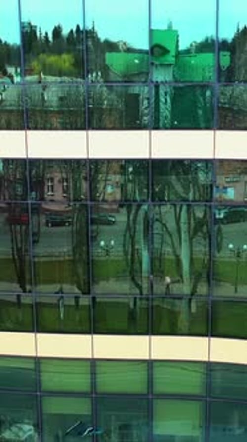Windows of skyscraper building. Modern office skyscraper with glass windows and reflection.
