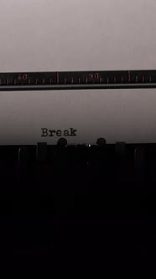 Typewriter Typing Breaking News on White Paper