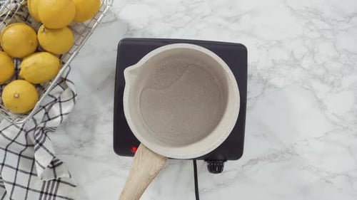 Step By Step Flat Lay Cooking Cake Syrup for Cake in a Saucepan