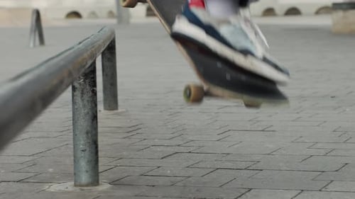 Young Skater Making 360 Flip Jump Performing Kickflip Trick Skateboarder Training in Skatepark