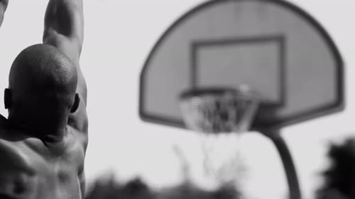 Basketball Player Shoots and Scores Action
