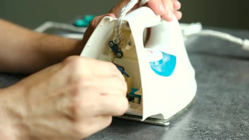 Fixing an Electric Iron, Close Up