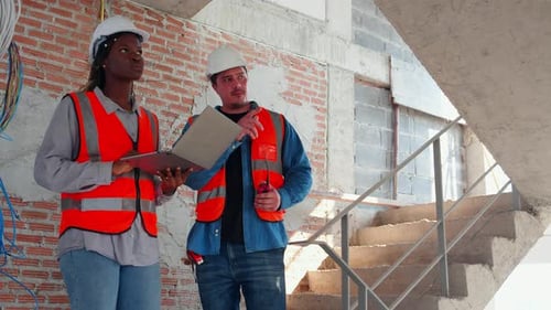 Team of architect or engineer looking laptop computer for inspection and planning construction.
