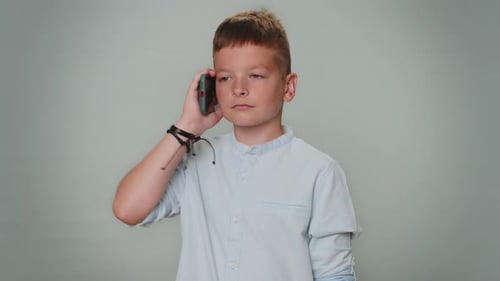 Happy Boy Chatting on Mobile Phone