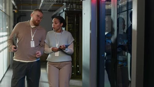 IT Colleagues Discussing Server Room Technology