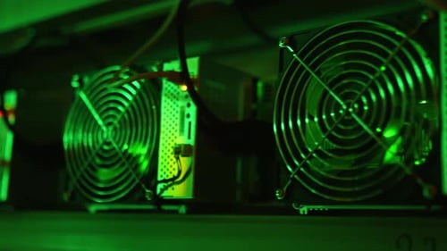 The ASIC Mining Equipment on Stand Racks Mine Cryptocurrency in Steel containerBitcoin Miners in