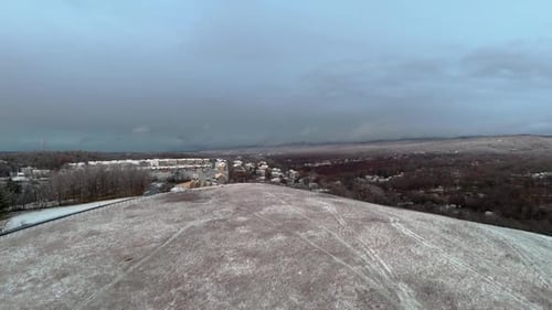 Aerial Ascend Revealing Snow-Covered Streets in Morgantown with Quiet Atmosphere