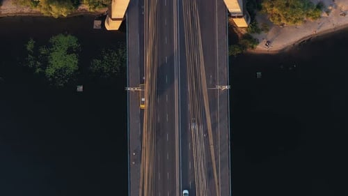 Aerial View of a River Bridge with Moderate Car Traffic