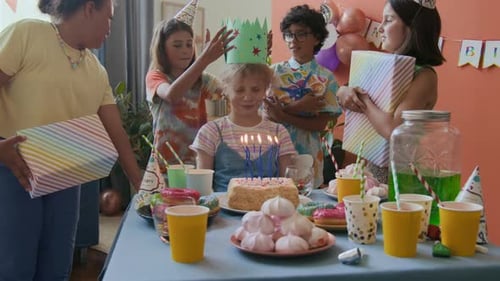 Children Celebrate Birthday with Cake and Gifts