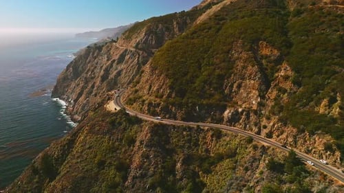 Big Sur Morro Bay rocks towering over the ocean waters. Highway in the mountains the Pacific Ocean