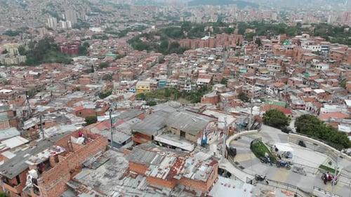 Aerial View Of Medellin, Colombia - Flying Over Comuna 13 Slums During Daytime - drone pullback