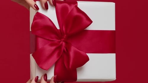 Gift Box with a Red Bow on Red