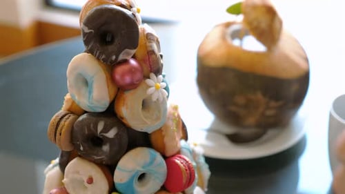 Delicious Donuts Pyramid on Table in Hotel