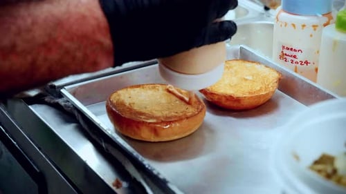 4K Cinematic food cooking footage of a chef preparing and making a delicious homemade burger in a re
