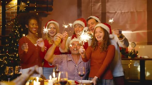 Family Celebrates Christmas with Sparklers at Home