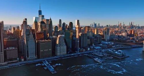 Skyscrapers standing side by side at the waterfront of the East River. New York scenery