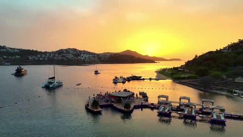 Party on the Dock – Aerial Footage of a Sunset Celebration