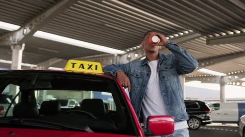 Taxi Driver Drinks Coffee Next to Car