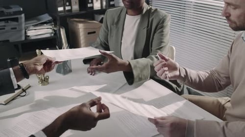 Business Partners Signing Joint Agreement in Solicitors Office