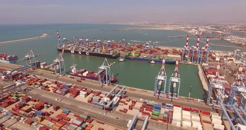 Commercial port with container ships - Top down aerial view.