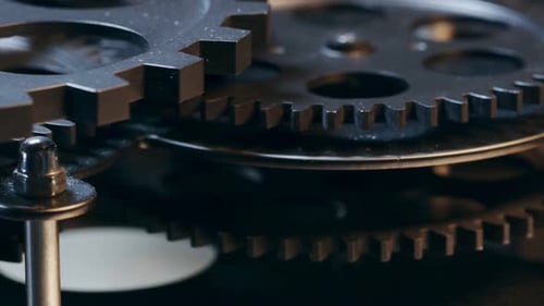 Mesmerizing Close Up of Interlocking Metallic Gears Turning