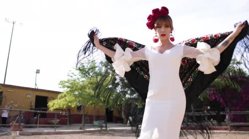 Woman in White Dress Dancing Outdoors with Shawl