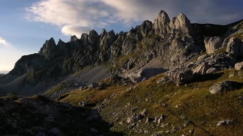 Sharp mountain peaks at sunset. Lots of rocks. Aerial view.