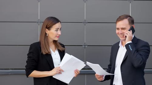 Office Workers Throw Papers As Result of Successful Deal