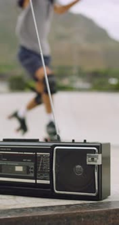 People, radio and legs with rollerskates in urban park for retro stereo or outdoor freedom