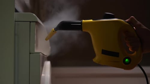 Steam Cleaner Used on Washing Machine Frame