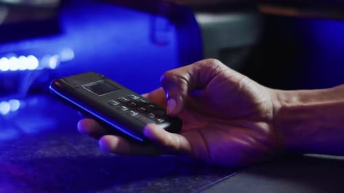 Video of hands of diverse barman and customer making contactless credit card payment at a bar
