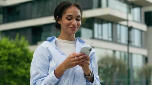 Happy Joyful African American Business Woman Using Smartphone City Outdoors Smiling Female