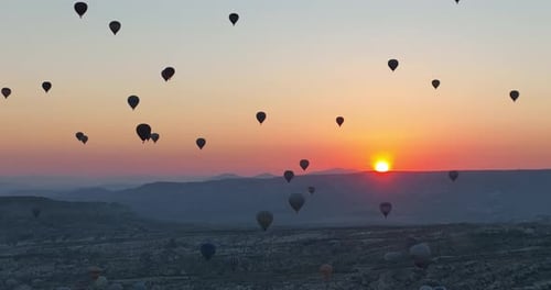 Aerial Cinematic Drone View of Colorful Hot Air Balloon Flying Over Cappadocia