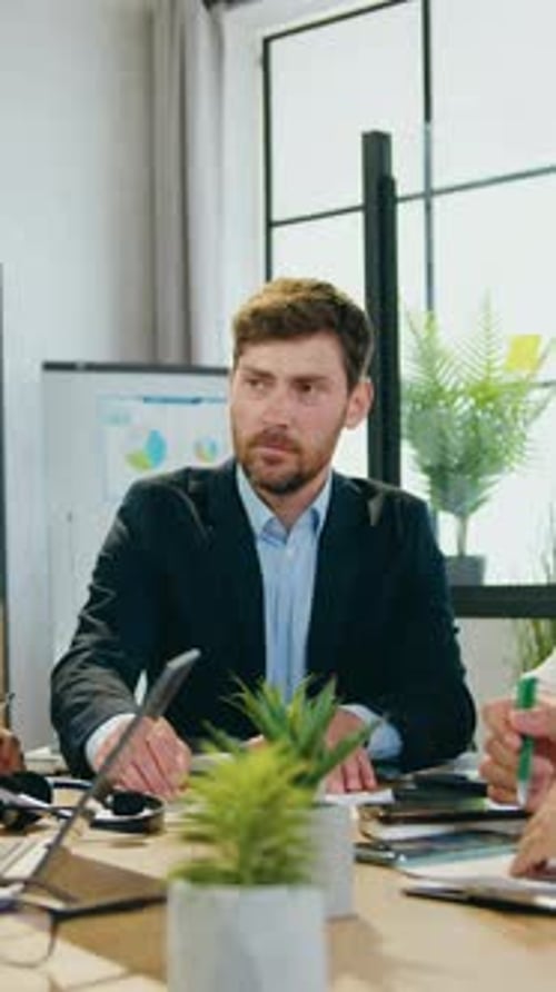 Business Team Hands Together Celebrating Success in Office