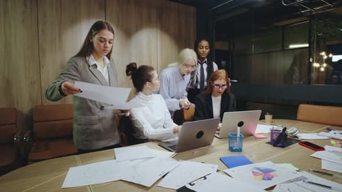Engaging Collaborative Women Team Meeting Taking Place in a Modern Office Setting Designed to