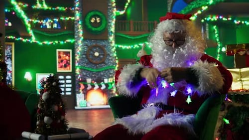 Man Dressed as Santa Claus Untangling Christmas Lights