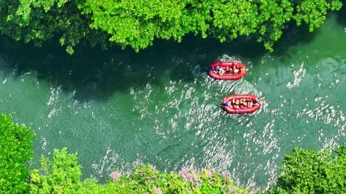 The aerial view showcases a thrilling rafting adventure.