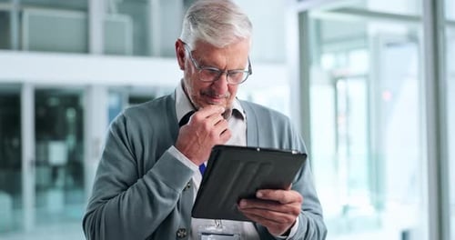 Business, tablet and thinking with mature man in office for administration