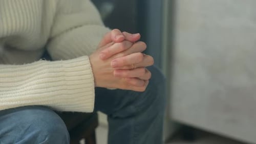 Anxious Woman Wringing Hands Close Up