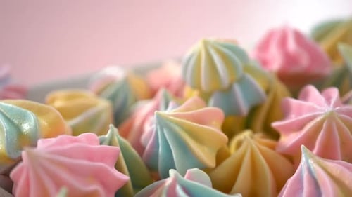 Multicolored Unicorn Meringue Cookies on a White Serving Plate