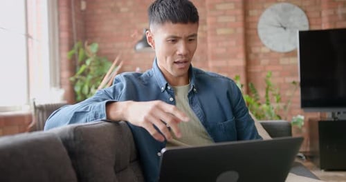 Man Using Laptop Talking on Video Conference