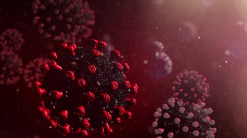 Particules virales se propageant dans un environnement sombre avec une lueur rouge