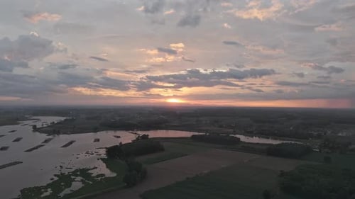 Aerial View Of A Body Of Water With Various Landforms Under A Cloudy Sky
