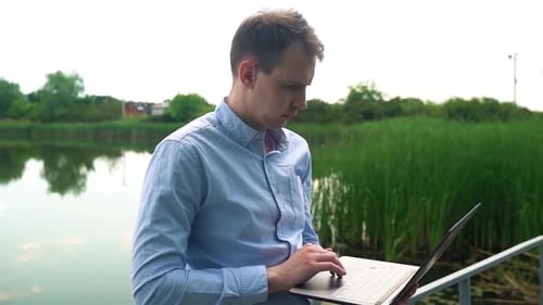 Close-up, freelancer working outdoors