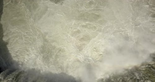 Aerial view over raging river and waterfall in Iceland