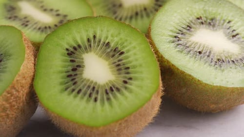 Fresh tropical kiwi fruit slices displaying natural green color